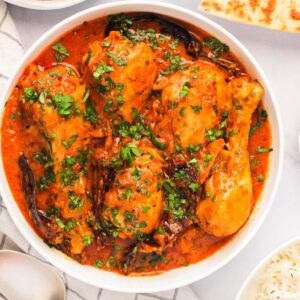 CHICKEN ACHARI CURRY slow-cooked with Punjabi garam masala and herbs in Cambridge, Ma