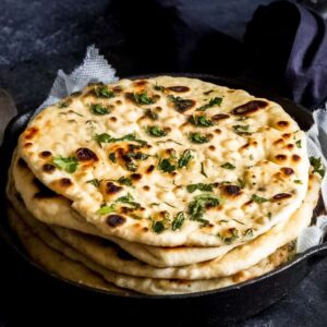 Naan topped with garlic in Cambridge, Ma